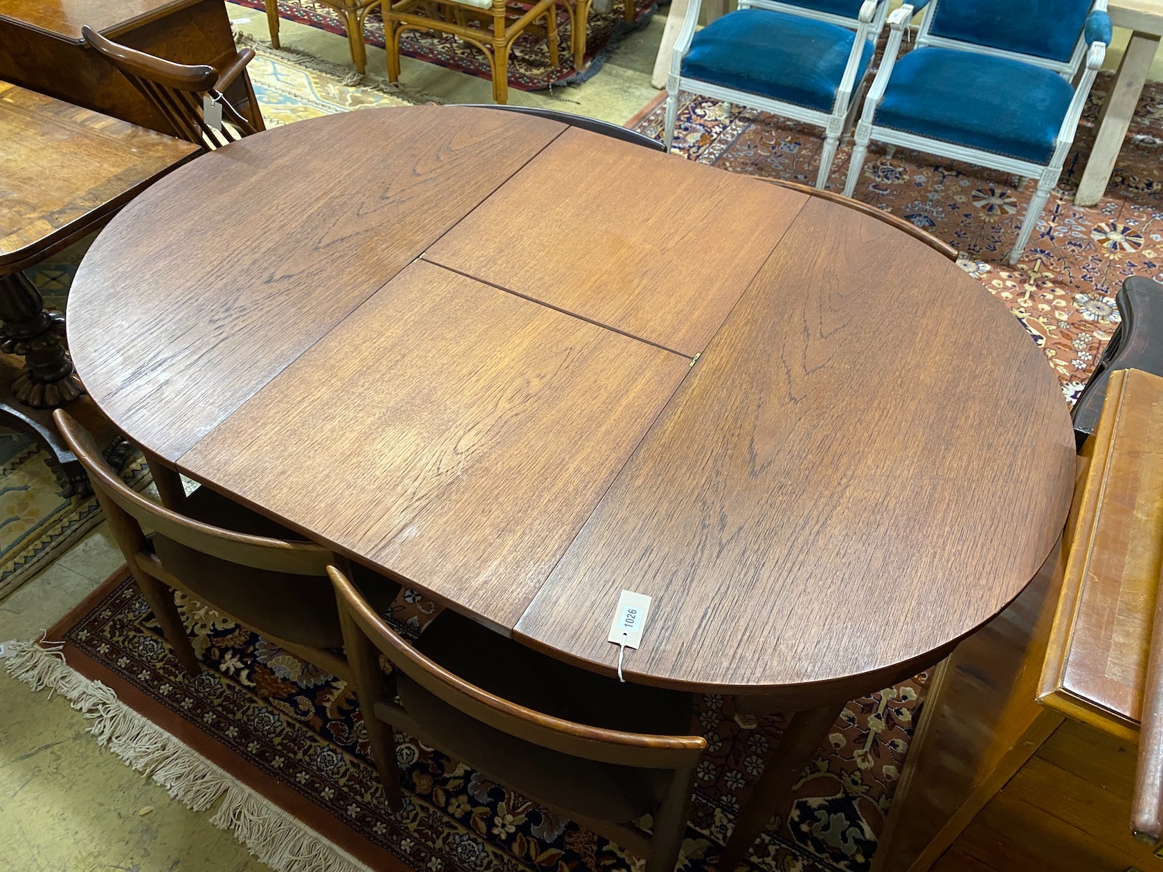 Hans Olsen for Frem Røjle a mid century teak extending dining table, length 156cm extended, depth 106cm, height 73cm and six chairs, chairs stamped to underside.